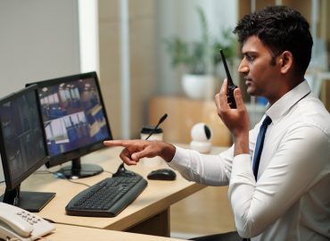 Security Guard Monitoring Surveillance Footage